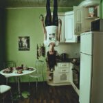 young woman, in the ceiling, head down